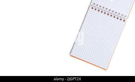 Blank notepad with wire binding isolated on a white background. Top view with copy space. Stock Photo