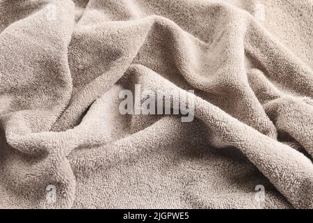 A soft, cozy blanket. Pleated fabric, background. Graphic resources Stock Photo