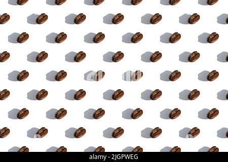 Seamless coffee pattern. Top view on coffee beans isolated on white background. Stock Photo