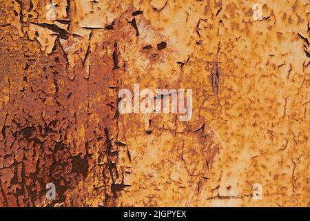 The steel metal surface is rusty. Old paint peels off. Corrosion of iron in air. Corrosion of metal. Aging. Temporary changes. Vintage style. Abstract rusty background Stock Photo