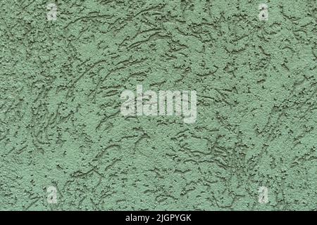 Grunge green textured concrete wall. Abstract stylish background. Decorative textured plaster, outside surface finish. Stock Photo