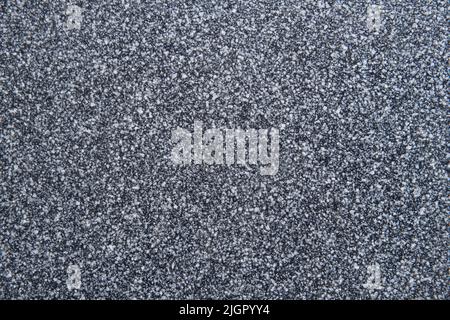 Beautiful abstract background. Granite black and white tiles. A decorative background with an interesting bubble structure. Construction concept. Stock Photo