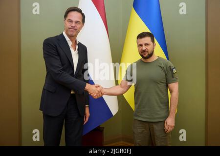 Kyiv, Ukraine. 11th July, 2022. Ukrainian President Volodymyr Zelenskyy shakes hands with Dutch Prime Minister Mark Rutte, left, before the start of their bilateral meeting at the Mariinskyi Palace, July 11, 2022 in Kyiv, Ukraine. Credit: Ukrainian Presidential Press Office/Ukraine Presidency/Alamy Live News Stock Photo