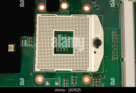 electrical circuit from a laptop, with a socket for a processor, close-up Stock Photo
