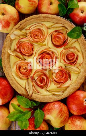Freshly baked apple pie on wooden table. Stock Photo