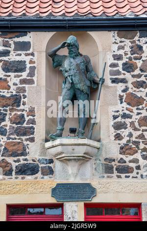 Statue of Alexander Selkirk, the inspiration for Robinson Crusoe, on the site of his birthplace in Lower Largo, Fife.  DETAILS IN DESCRIPTION. Stock Photo