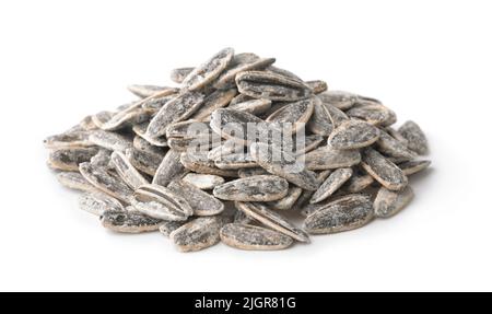 Heap of salted sunflower seeds isolated on white Stock Photo