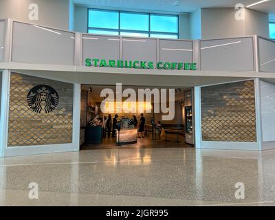 Ft. Lauderdale,FL USA - July 1, 2022:  The exterior of a Starbucks coffee shop in the airport in Ft. Lauderdale, Florida. Stock Photo