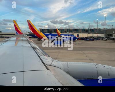 Ft. Lauderdale, FL USA - July 1, 2022: Southwest airplane wing view leaving the Ft. Lauderdale airport getting ready for take off. Stock Photo