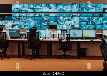 Empty interior of big modern security system control room, workstation with multiple displays, monitoring room with at security data center Empty Stock Photo
