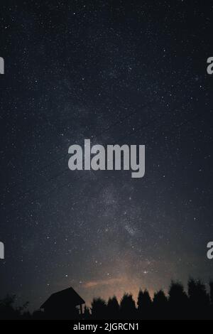 A Vertical shot of a starry night sky picturing milky way Stock Photo ...
