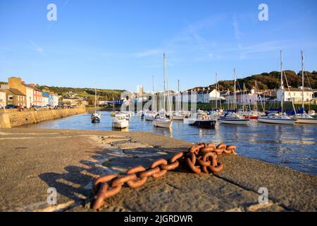 An evening view at Aberaeron Harbour, Wales, during a high tide with moored boats Stock Photo