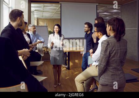 Confident businesswoman head meeting with colleagues Stock Photo
