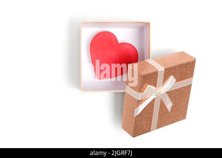 Open gift box with heart inside with blue ribbon and bow white background Stock Photo
