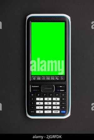 Graphic Calculator with a green screen to place content there. Graphic calculators are used in schools and universities. Stock Photo