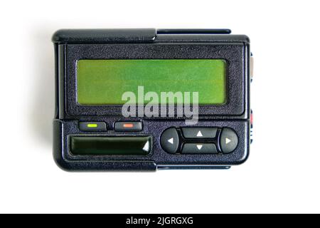 Pager old retro communication device, white background.Outdated technologies Stock Photo