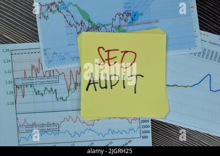 Concept of SEO Audit write on sticky notes isolated on Wooden Table. Stock Photo
