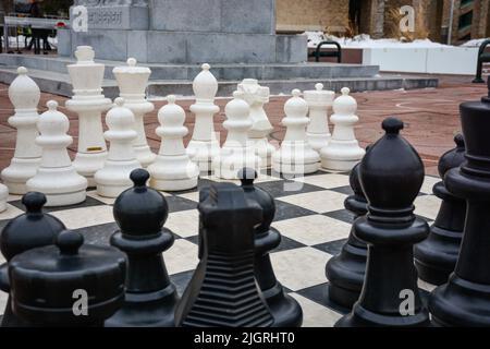 a giant chessboard on the ground in a public park Stock Photo