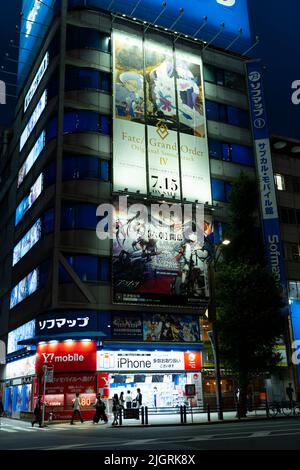 Akihabara, Japan- July 30, 2020: Posters are displayed on a building, during the night, in Akihabara. Stock Photo