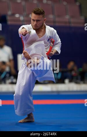 Hector Cencion from Panama performs a kick during Karate competition with Kata demonstration at The World Games 2022 in Birmingham. The games are a quadrennial international multi-sport event for sports not included in the Olympic Games. Hosting city is Birmingham, Alabama, USA. (Photo by Alexander Bogatyrev / SOPA Images/Sipa USA) Stock Photo