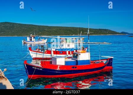 Traditional fishing boats at Steni Vala port the second most populous village on the Greek island of Alonnisos, a picturesque Greek island in Sporades Stock Photo