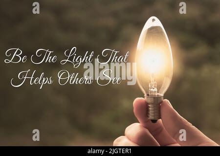 Motivational and Inspirational quote - Be the light that helps others see. With light bulb in vintage color background. Motivational concept Stock Photo