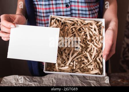 Post package with blank card free space Stock Photo
