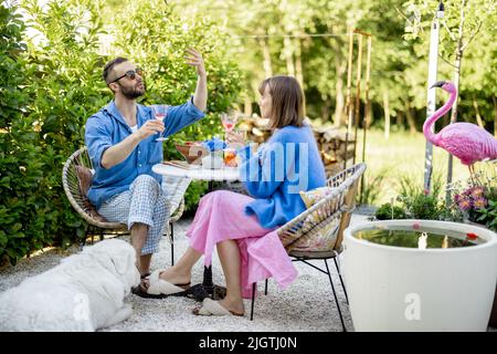 Stylish couple spend romantic evening at backyard Stock Photo