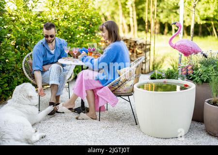 Stylish couple spend romantic evening at backyard Stock Photo