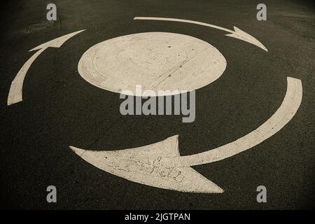 Small painted roundabout on the road Stock Photo