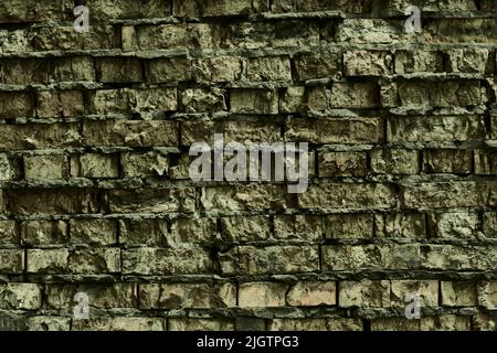 Big gloomy dark full background of detailed old gray brick wall .  Stock Photo