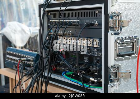 Close up audio snake and stage box with xlr cables and jacks at a live show Stock Photo