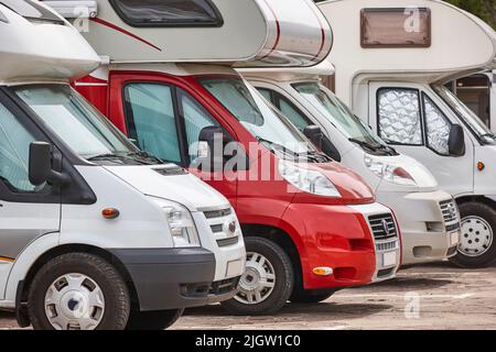 Recreational vehicle in a parking lot. Camper van. Tourism Stock Photo