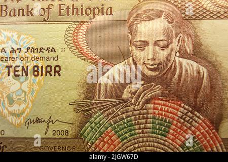 Ten Ethiopian birr banknote. Ethiopian woman weaving basket. Fragment of a banknote. Stock Photo