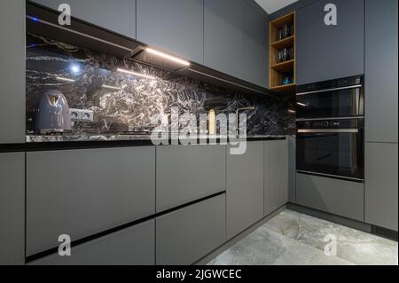 Corner view closeup to grey luxury kitchen Stock Photo