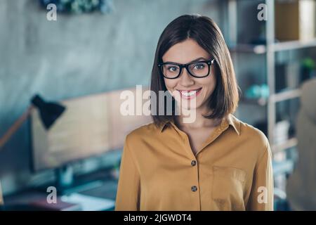 Photo of young charming girl good mood eyewear smart website engineer data agent ceo boss chief indoors Stock Photo