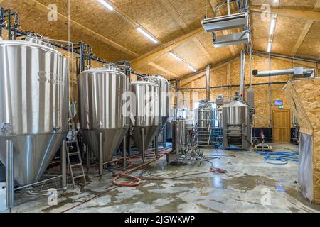 Trois Becs Brewery in Beaufort-sur-Gervanne, France. The brewery and brewhouse of the Brasserie des Trois Becs are housed in a simple and functional wooden building Stock Photo