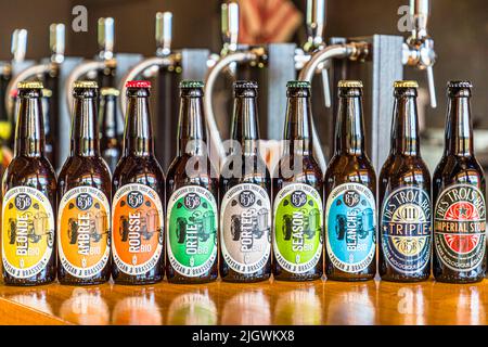 When we visited in June, the four regular beers and the two seasonal beers, spring and summer, were available in bottles. For the sake of completeness, the fall and winter beers are still here in the bottle design of the previous year. Trois Becs Brewery in Beaufort-sur-Gervanne, France Stock Photo