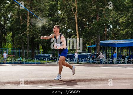 male athlete javelin throwing at competition Stock Photo