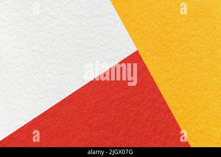 Texture of craft white, yellow and red shade color paper background, macro. Structure of vintage abstract cardboard with geometric shape and gradient. Stock Photo