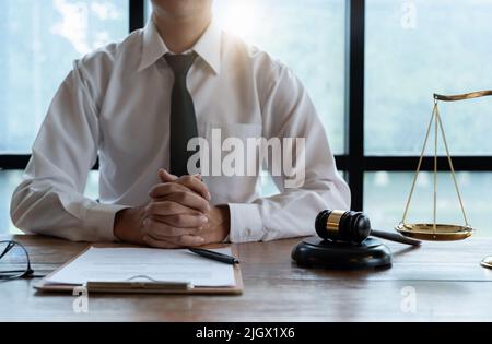 Close up business lawyer man reaching out sheet with contract agreement proposing to sign. accurate details, individual who owns the business sign Stock Photo