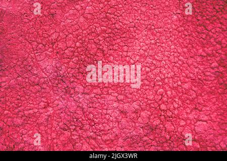 hot red-pink rough-textured surface background backdrop Stock Photo