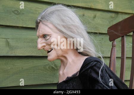 A Mannequin Figure of an Evil Witch in a Rocking Chair. Stock Photo