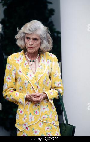 Eunice Kennedy Shriver, founder of the Special Olympics and sister of President John F. Kennedy, listens as U.S. President Bill Clinton delivers remarks during an event marking the 35th Anniversary of the Peace Corps in the Rose Garden of the White House, June 8, 1996 in Washington, D.C. Stock Photo