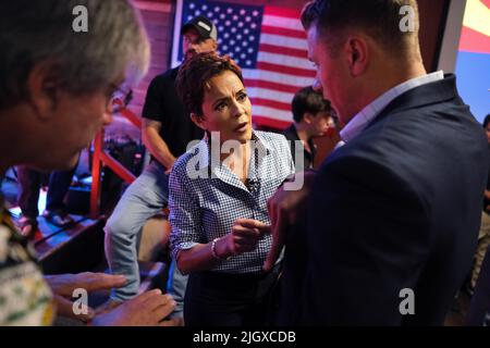 Tucson, Arizona, USA. 12th July, 2022. Republican candidate for Arizona Governor Kari Lake campaigns at the Maverick in Tucson. Lake is endorsed by former President Donald Trump and is running against Karrin Taylor Robson in a bitter race that has become a showdown between Governor Doug Ducey who backs Robson and the America First Trump endorsed Kari Lake. The GOP Republican primary in Arizona is August 2. (Credit Image: © Christopher Brown/ZUMA Press Wire) Stock Photo