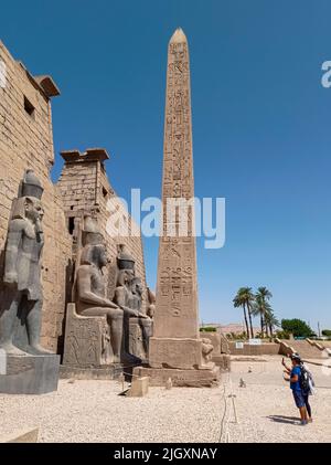 Ancient egyptian temple with an obelisk full of hieroglyphics and ...
