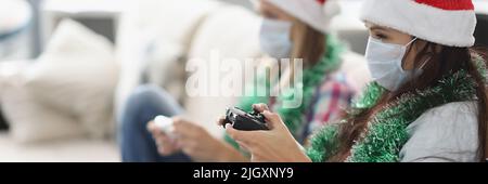 Friends have fun and playing video game using controlling joystick Stock Photo