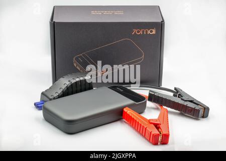 Kyiv, Ukraine - September 09, 2021: Portable Xiaomy 70MAI car jump starter closeup on white. Emergency charger booster Modern power bank battery. Stock Photo