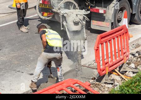 CityFibre full fibre network being installed, Southend on Sea area for Vodafone broadband. Groundworks underway, residential street. Pouring concrete Stock Photo