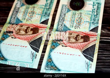 Obverse side of Saudi Arabia 20 SAR twenty Saudi riyals cash money banknote with the photo of king AbdulAziz Al Saud and Quba mosque in Madinah isolat Stock Photo